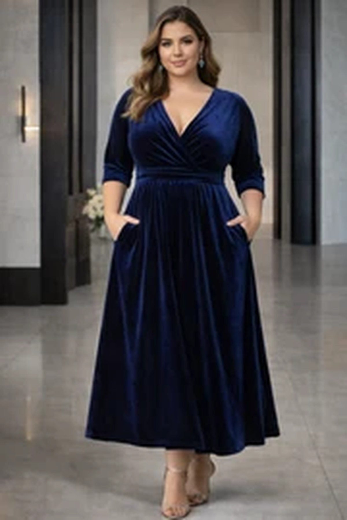 Plus size woman in a navy velvet wrap midi dress, fall wedding guest outfit