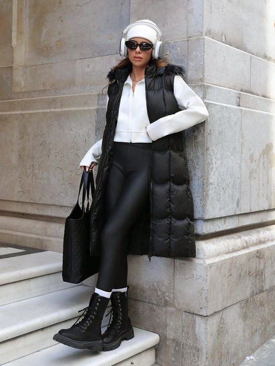 Longline puffer vest layered over leggings winter outfit