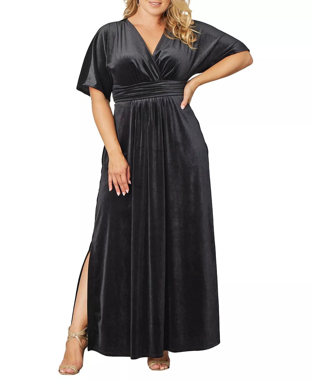 Plus size woman in a velvet maxi gown for a wedding