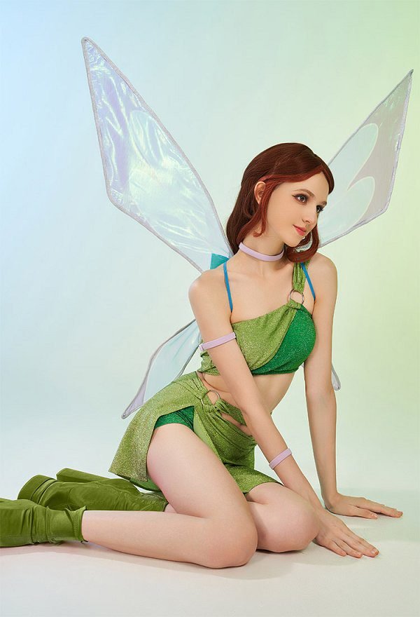 Three women in Winx Club fairy costumes with wings