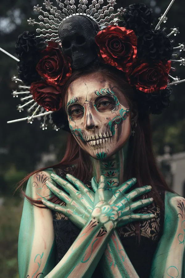Woman with glam skeleton Halloween face paint makeup