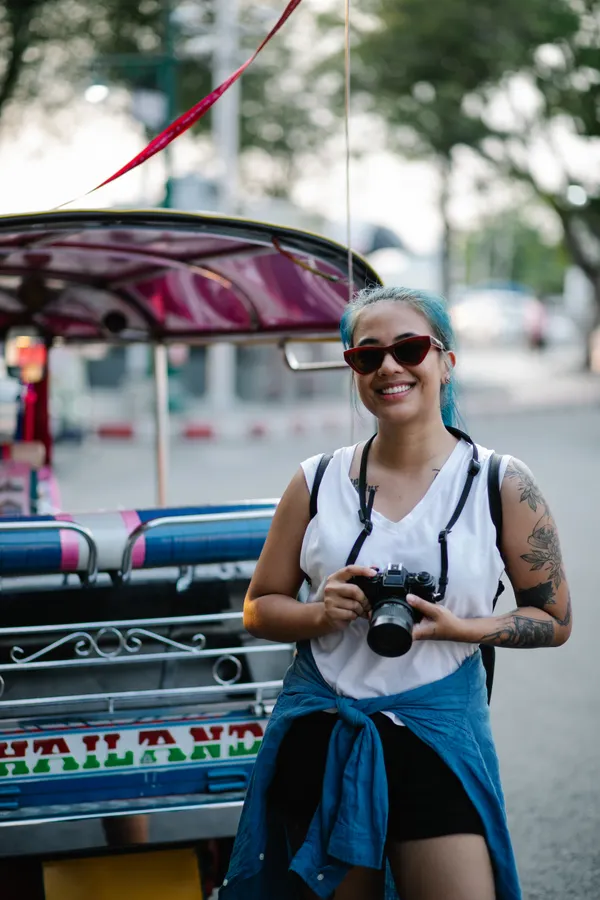 Woman in a funny lost tourist Halloween costume with camera