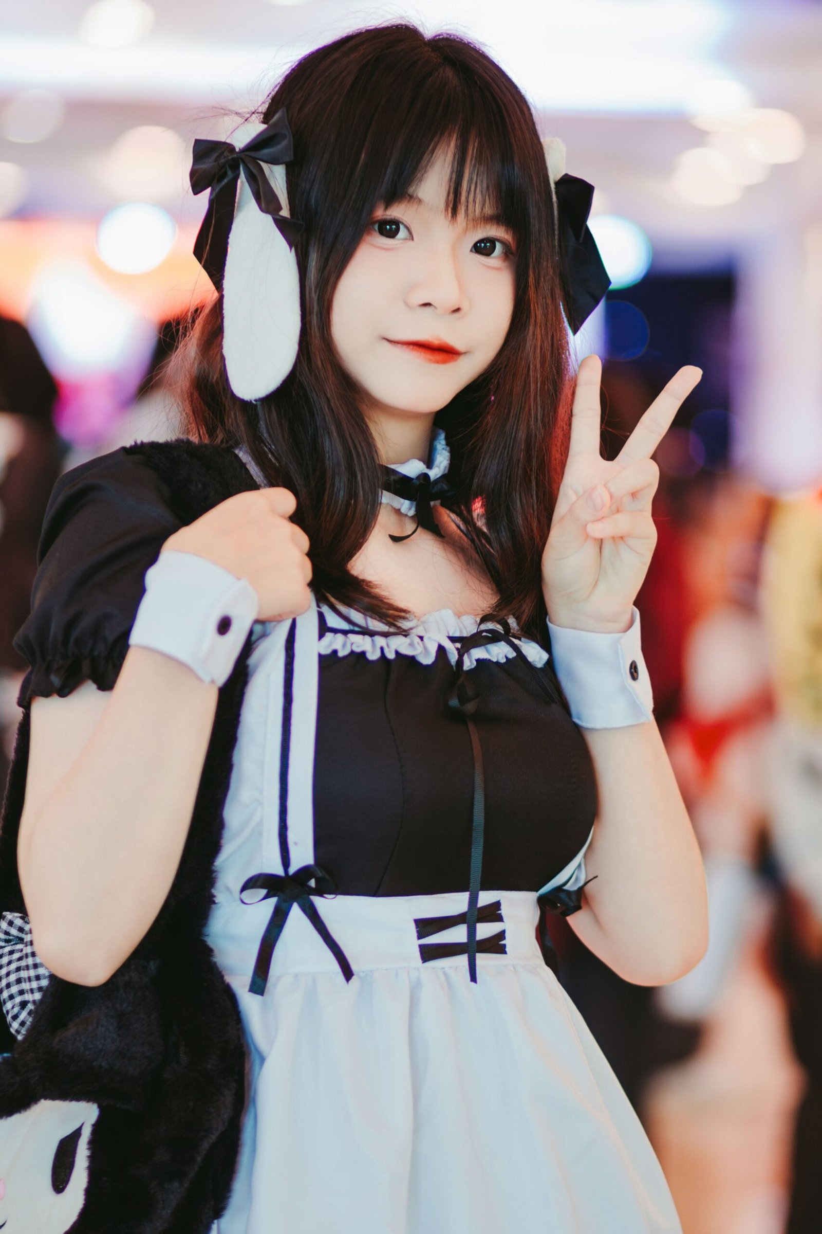 Woman in a French maid Halloween costume with apron