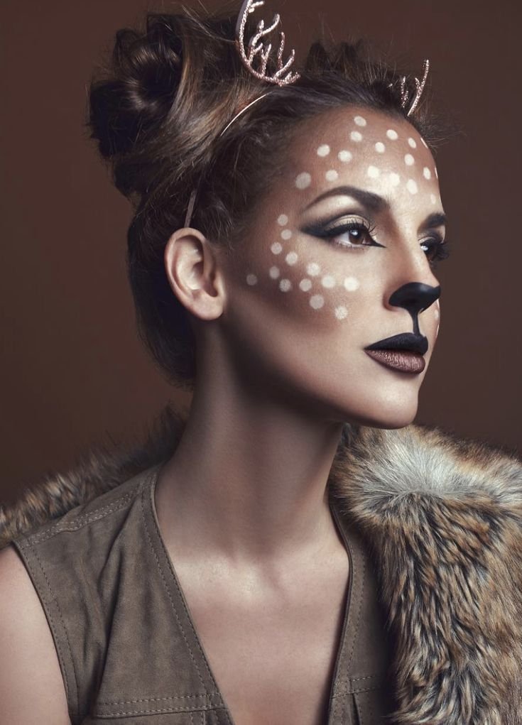 Woman with gentle fawn deer Halloween face paint makeup
