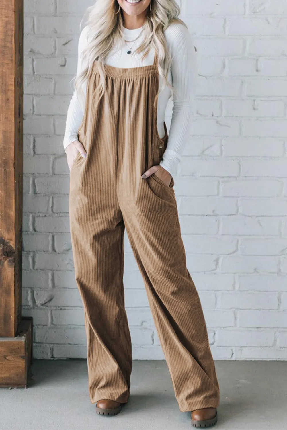 Woman wearing a wide-leg corduroy jumpsuit for fall