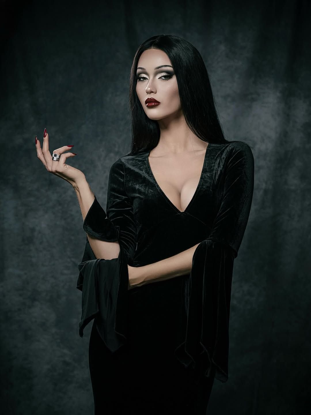Morticia Addams Halloween costume with a black dress