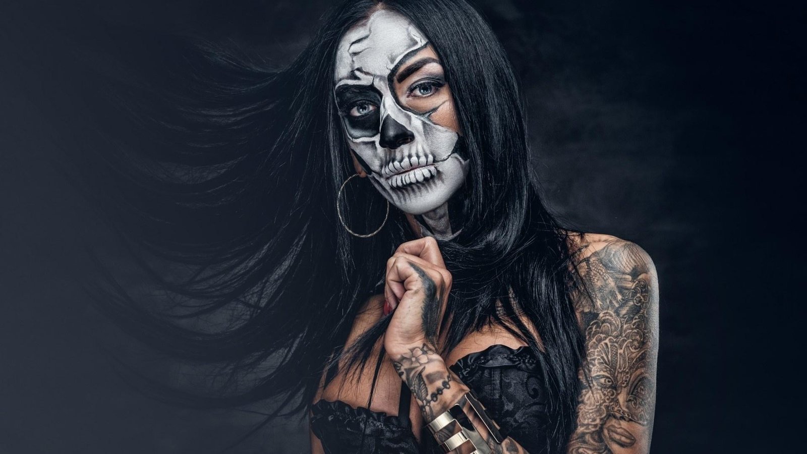 Skeleton Halloween costume with a black dress and skull makeup