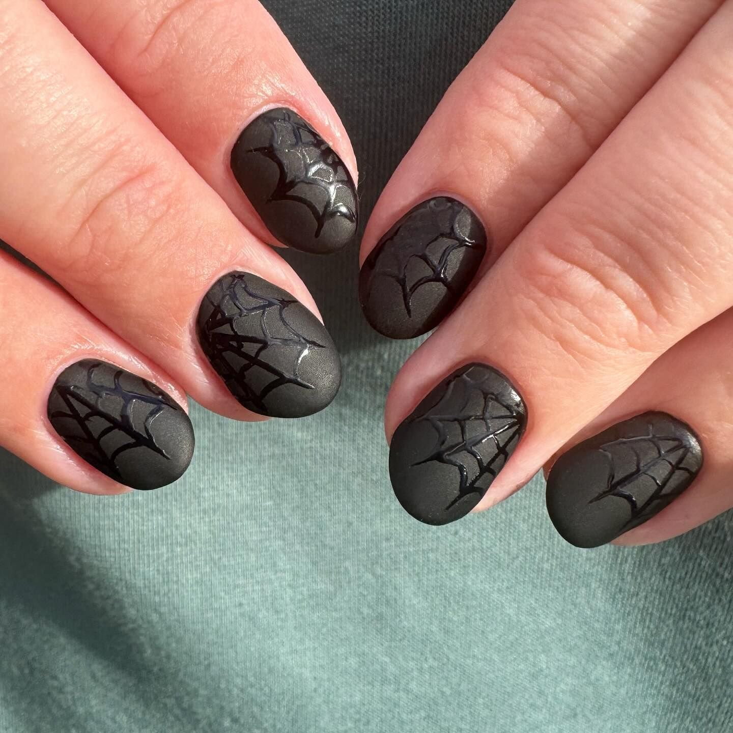 Micro French Halloween nails with spiderweb accent nail