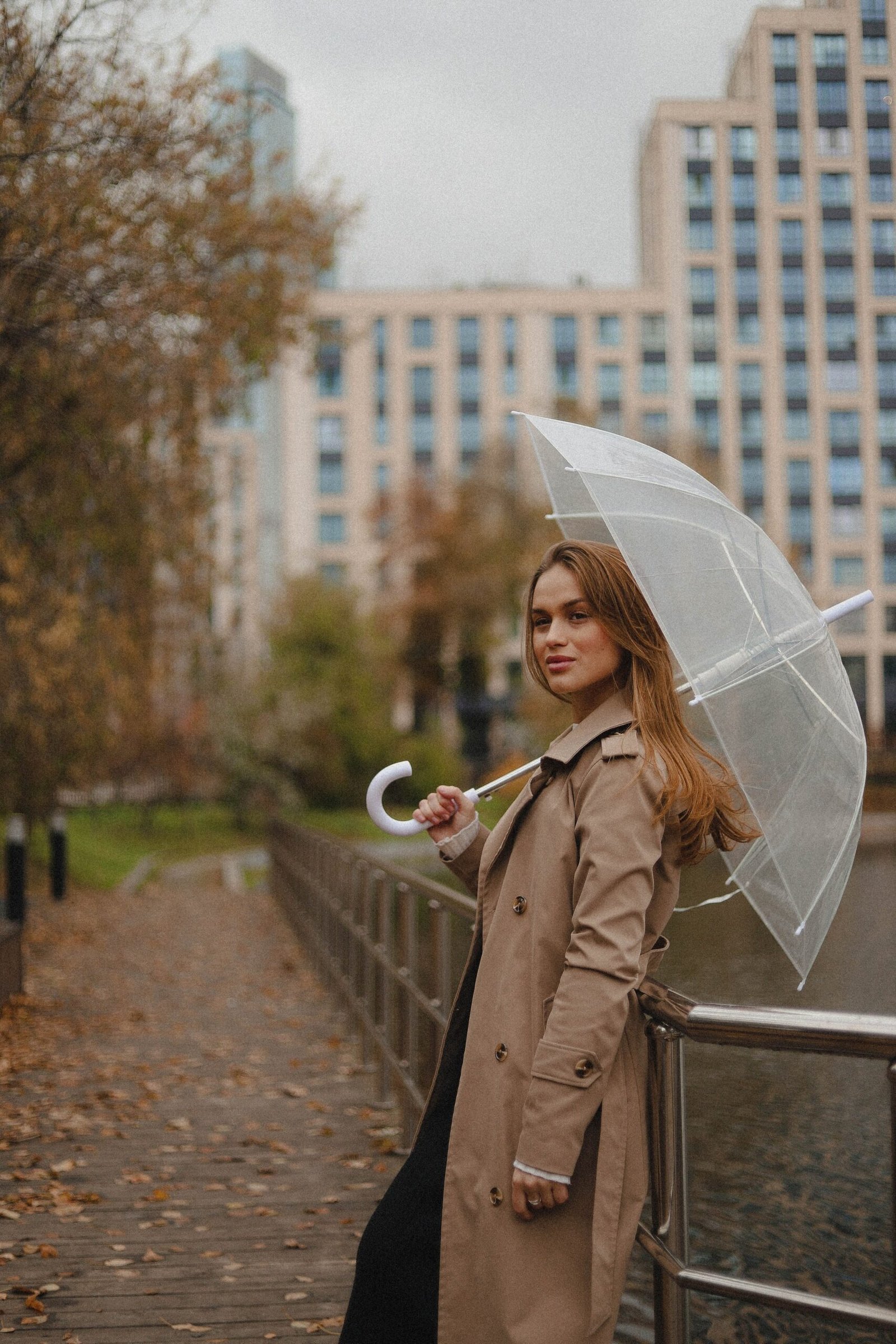 White umbrella with monochrome beige fall outfit