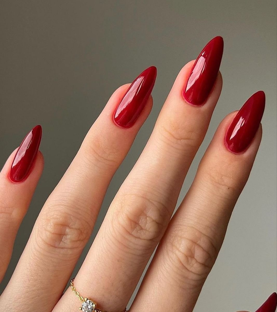 Glossy blood red almond shaped long nails