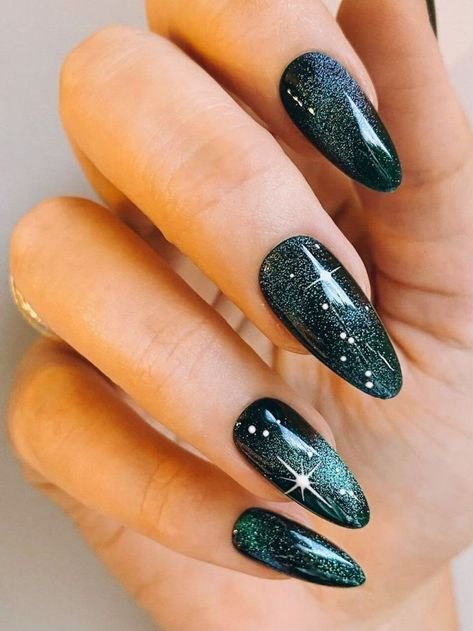 Dark green Halloween nails with a glitter moon and stars accent nail
