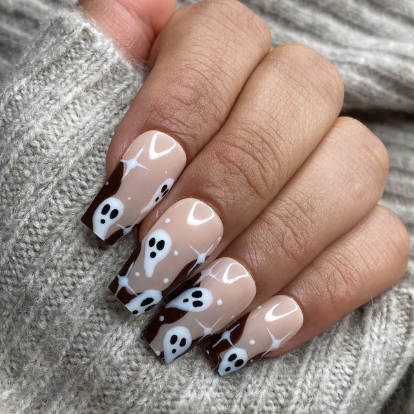 Chocolate brown Halloween nails with a cute ghost face accent nail