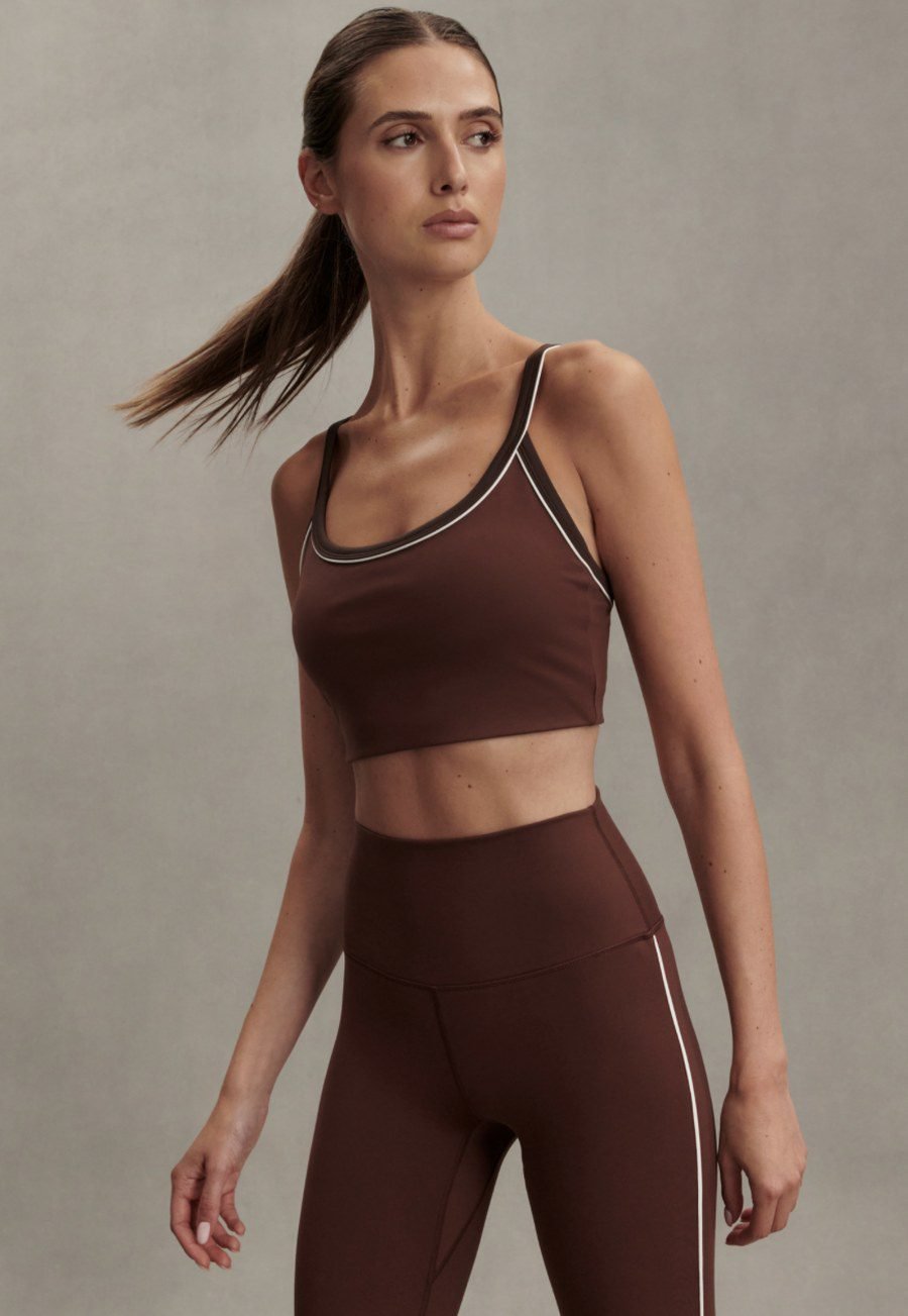 Woman wearing chocolate brown matching workout set athleisure