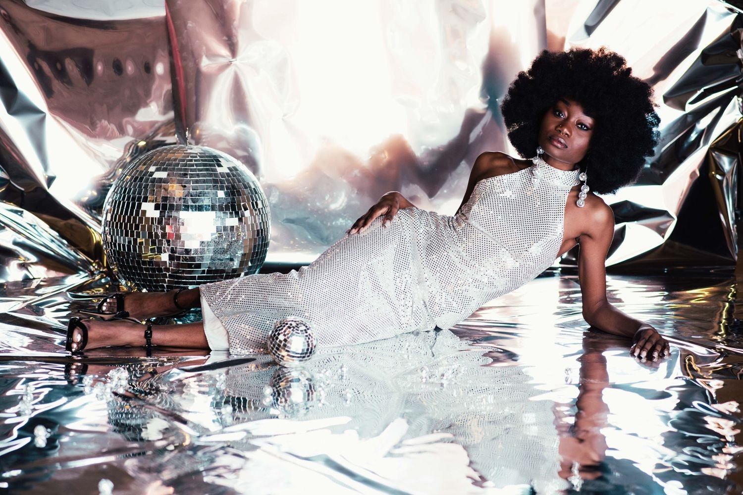 Black woman dressed as a disco queen Halloween costume with sequins