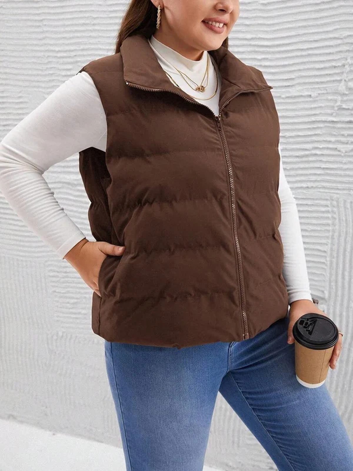 Plus size woman in a puffer vest and turtleneck