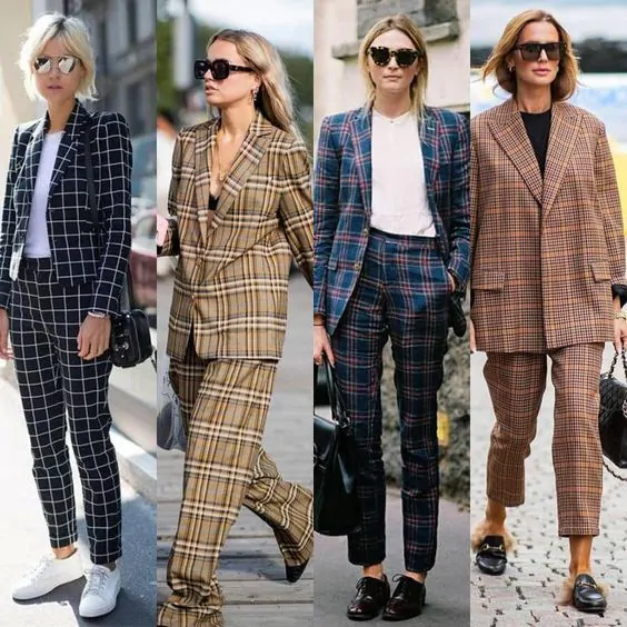 Woman wearing a windowpane plaid suit with a white tee