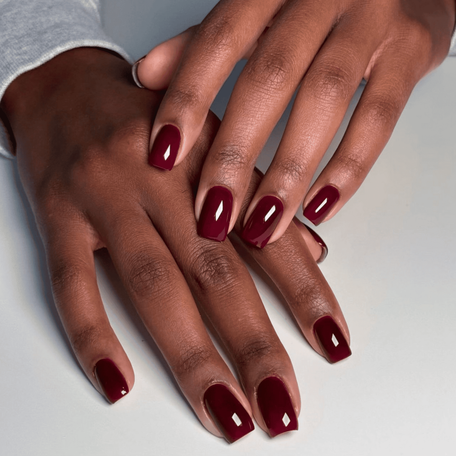 Oxblood nails on deep skin fall manicure