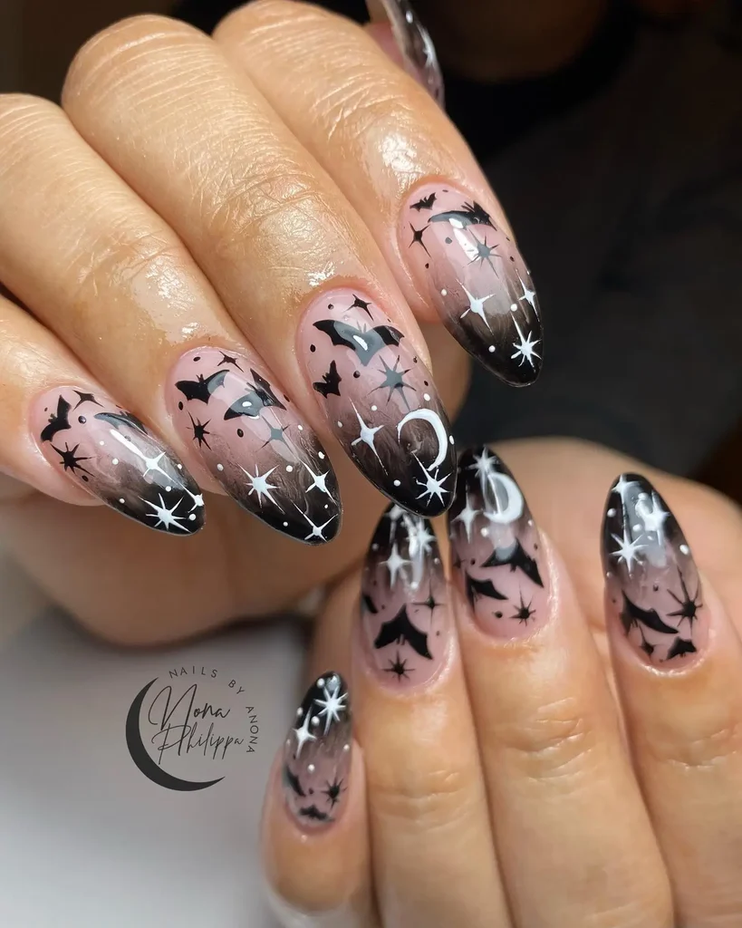 Minimalist bat and moon Halloween nail design