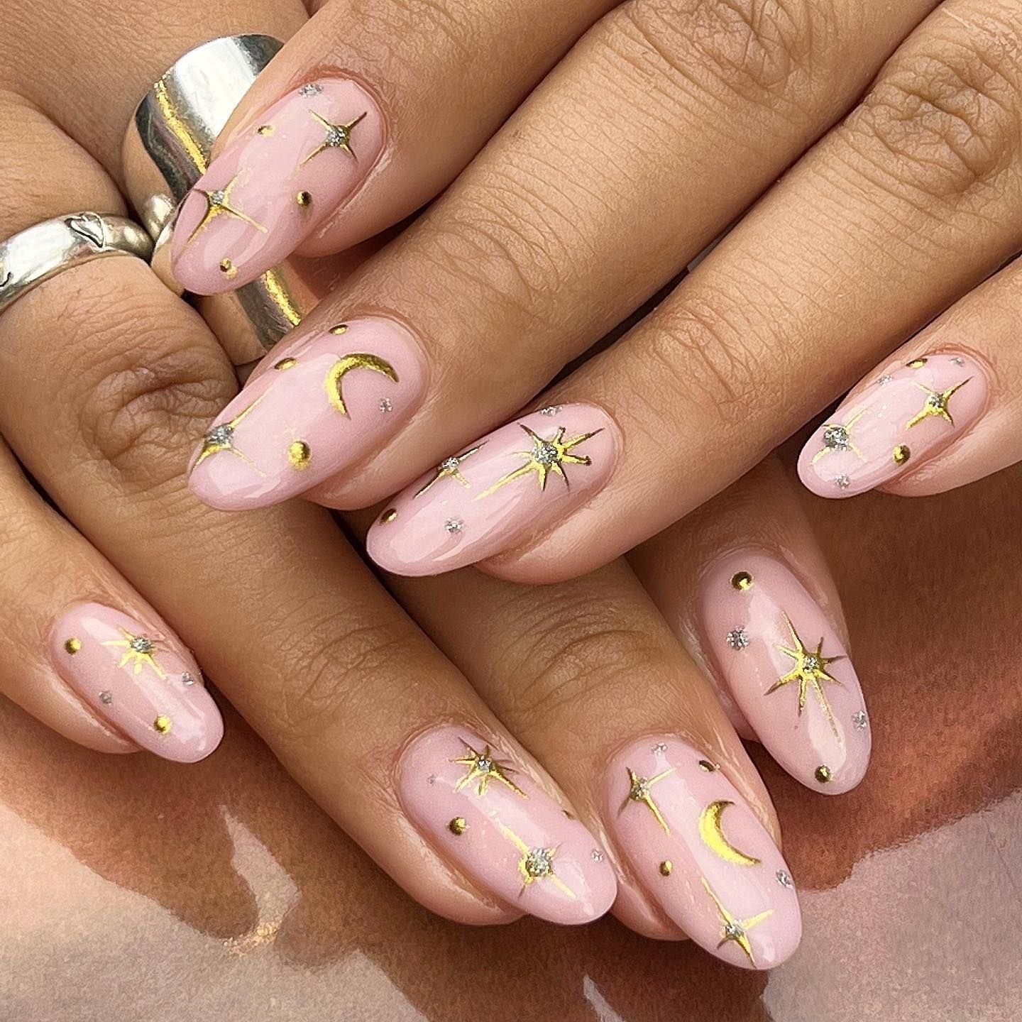Minimalist celestial nail art with moon and stars