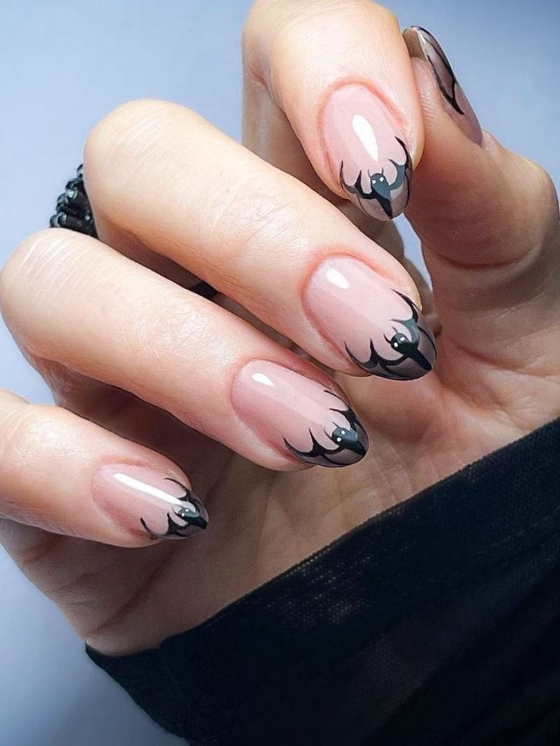 Bat nail art on french tip Halloween nails
