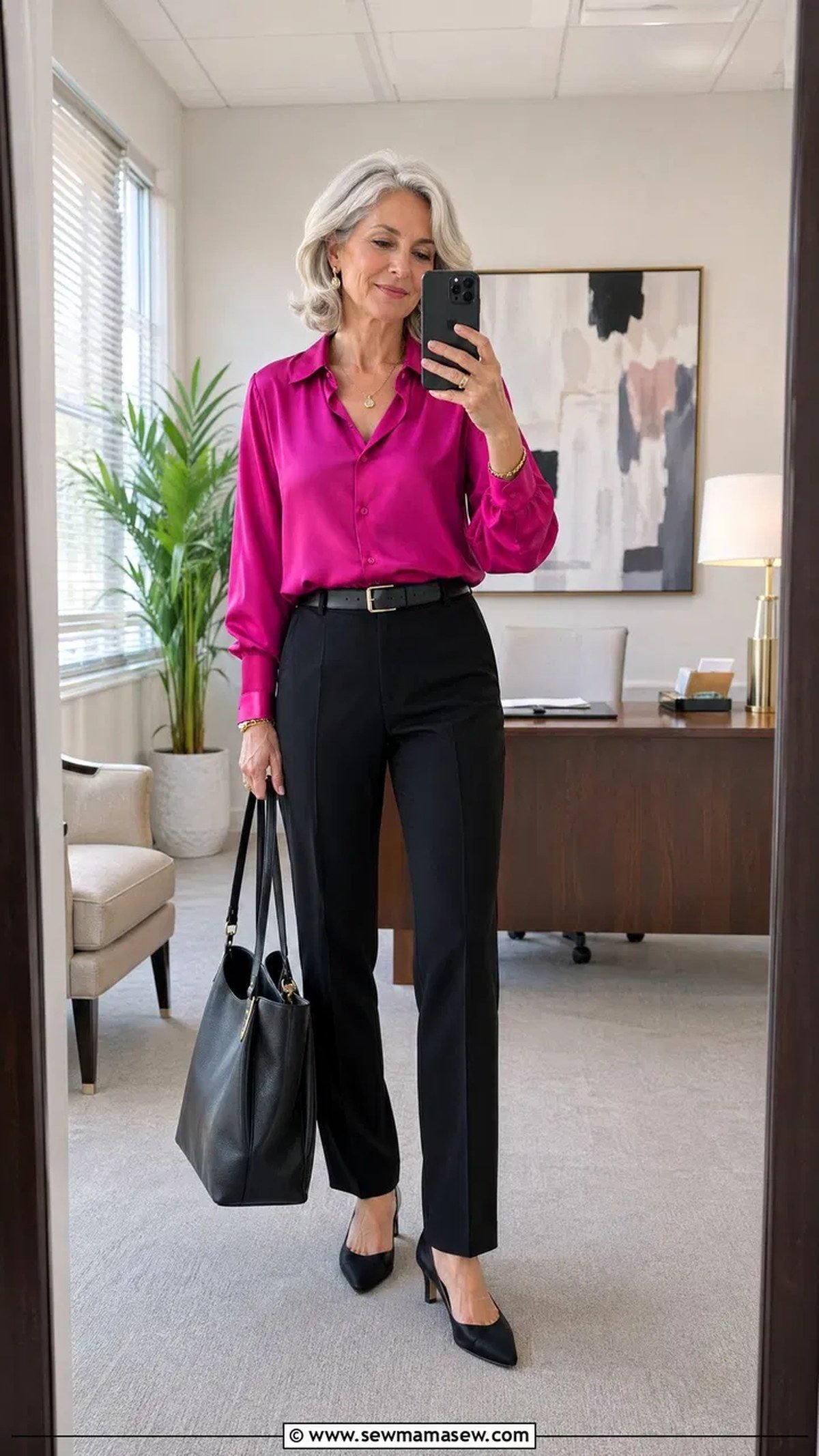 Woman over 40 in a navy shift dress with a gold statement necklace for work
