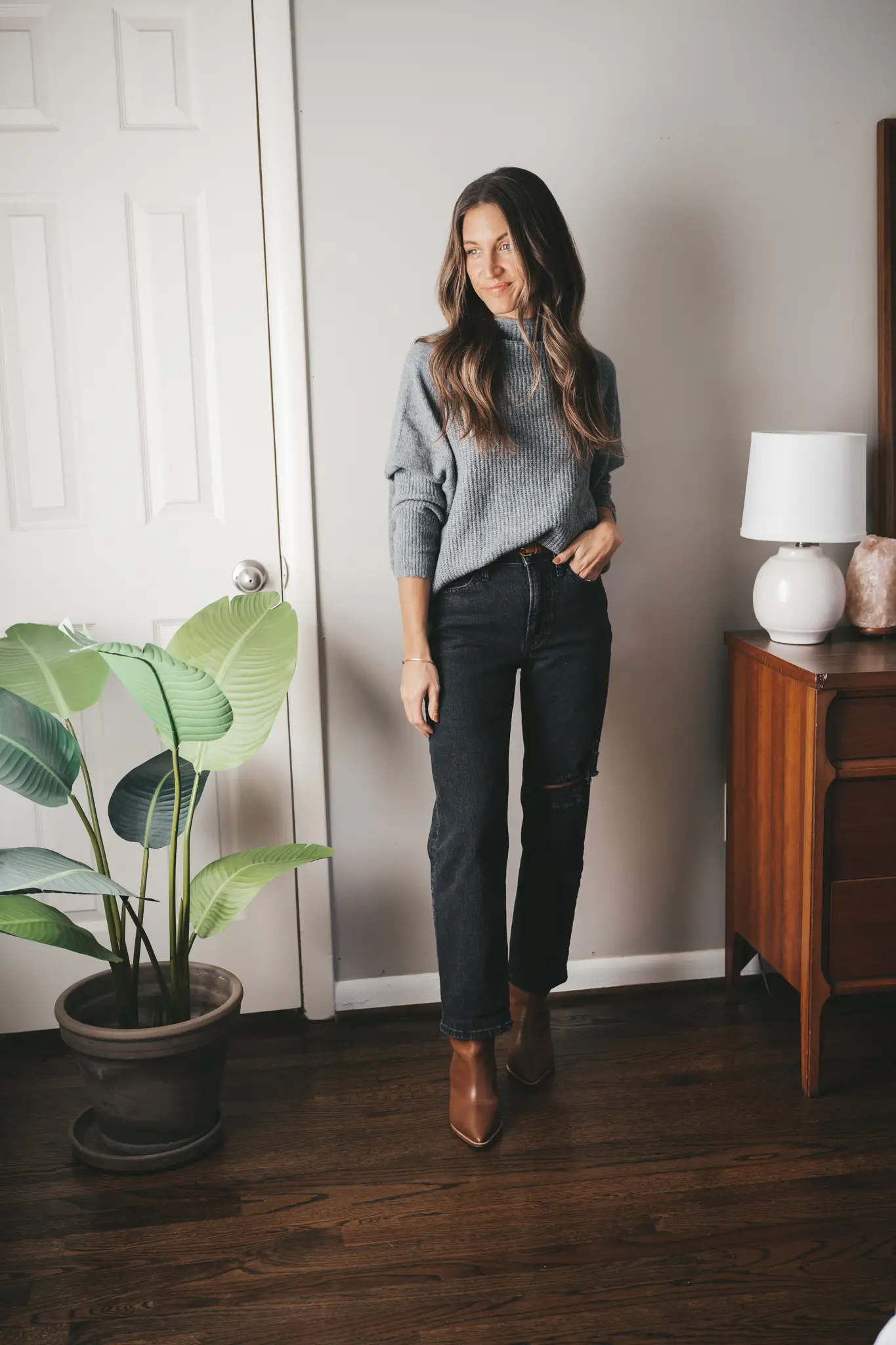 Woman in dark-wash straight-leg jeans