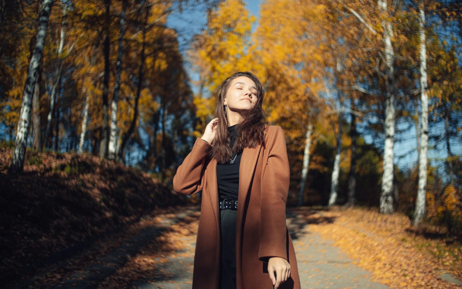 Woman wearing a chocolate brown monochrome outfit with a knit set