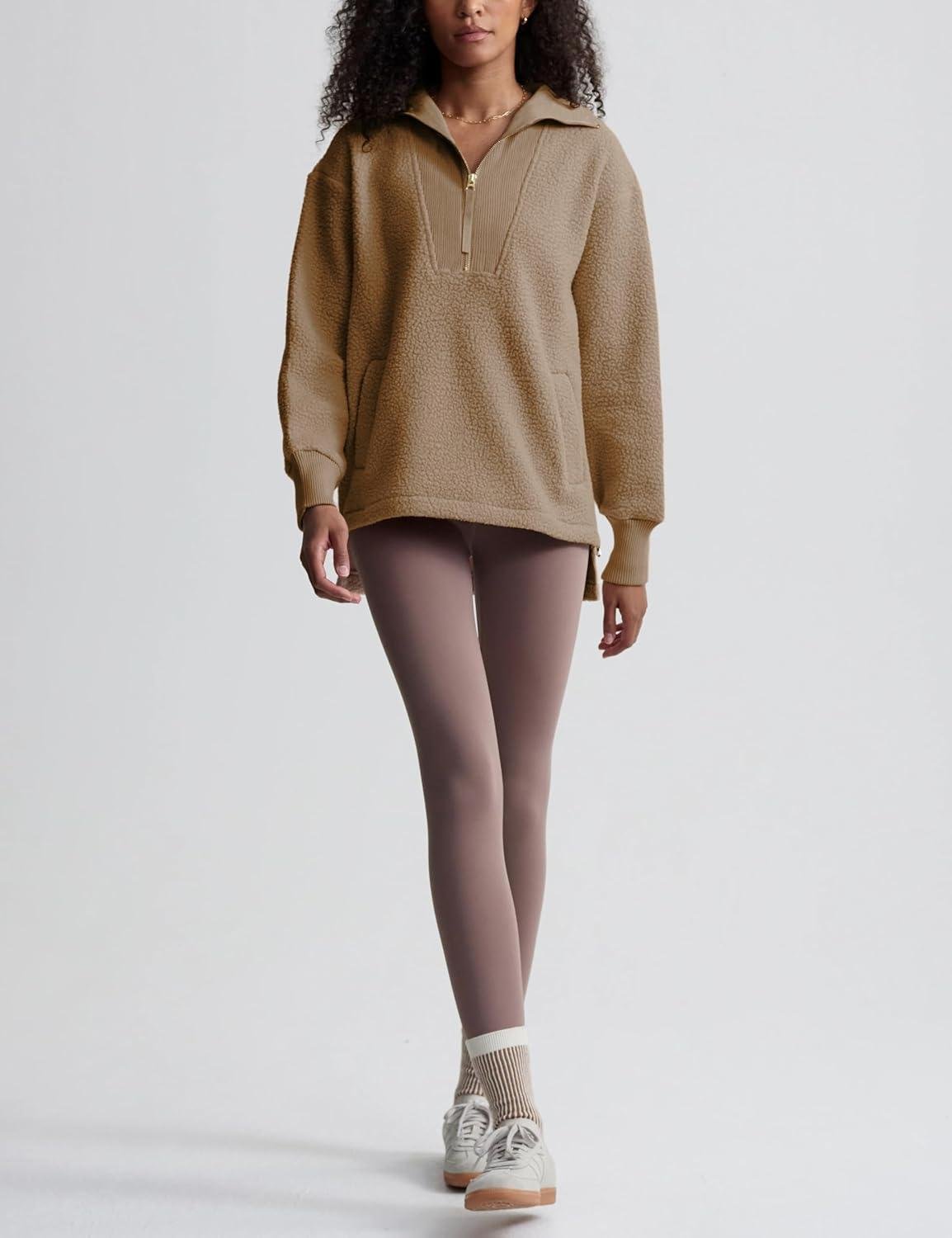 Woman wearing a sherpa pullover with leggings