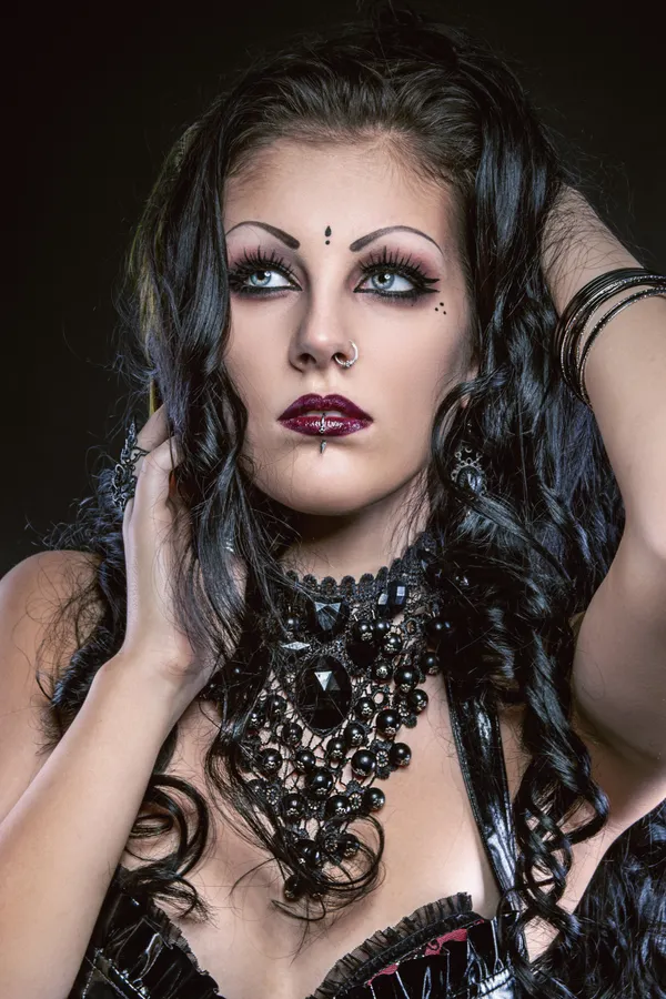 Woman dressed as a 00s goth Halloween costume with choker