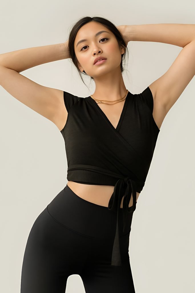 Woman in a wrap-front workout top with leggings