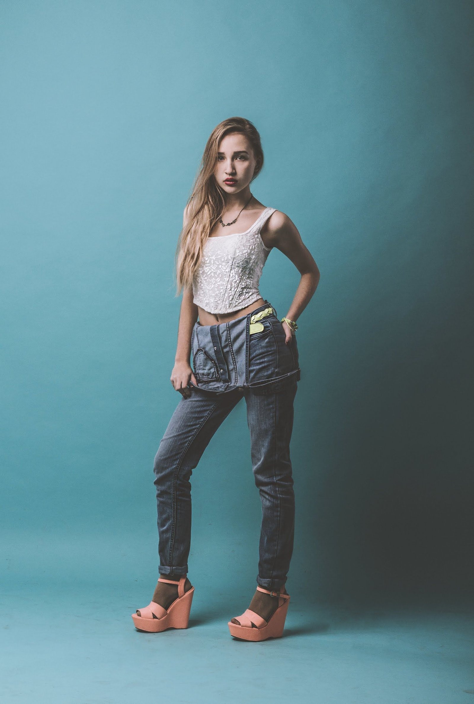Woman wearing low rise jeans 00s pop princess Halloween costume