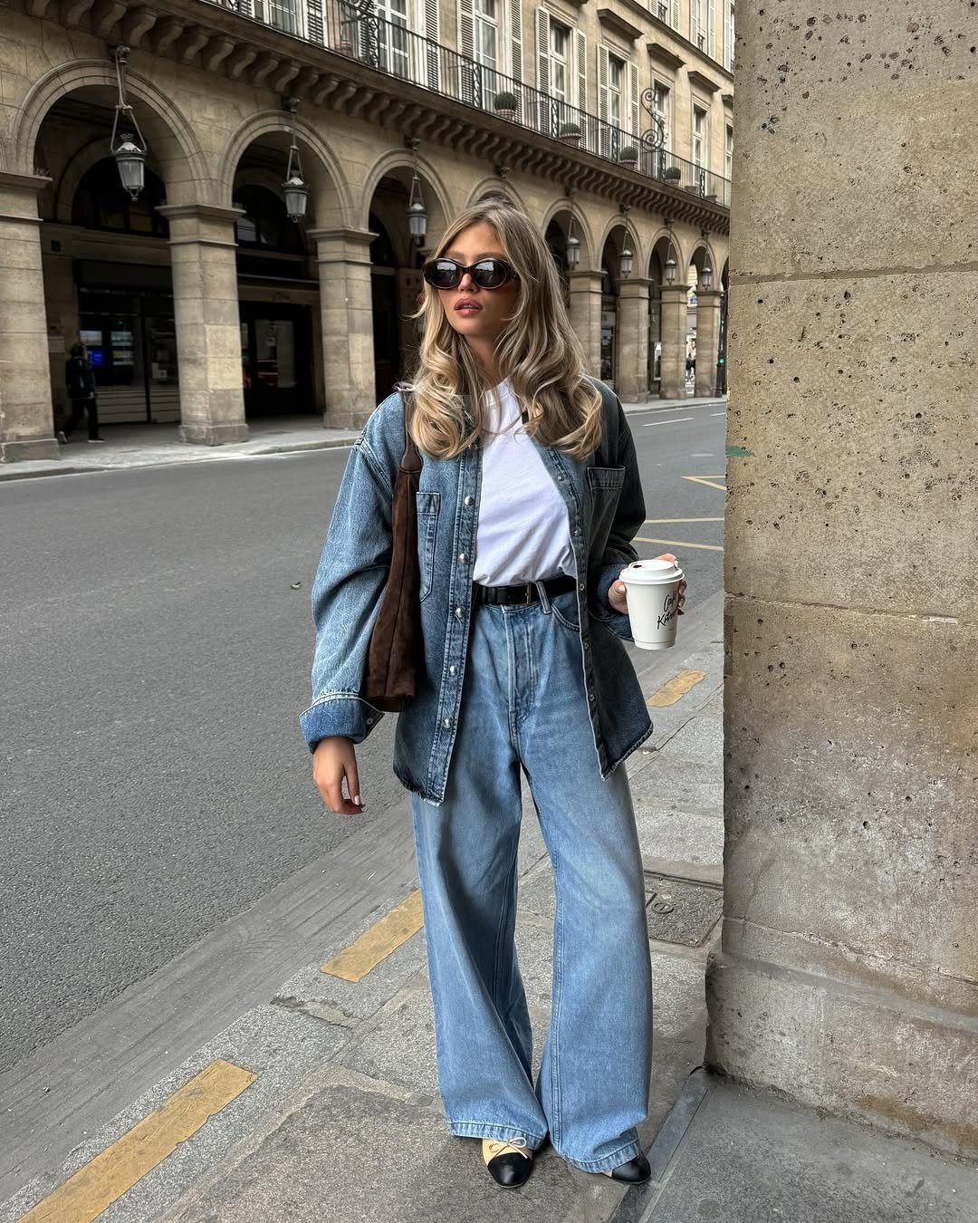 Woman in a double denim outfit with jeans and denim jacket