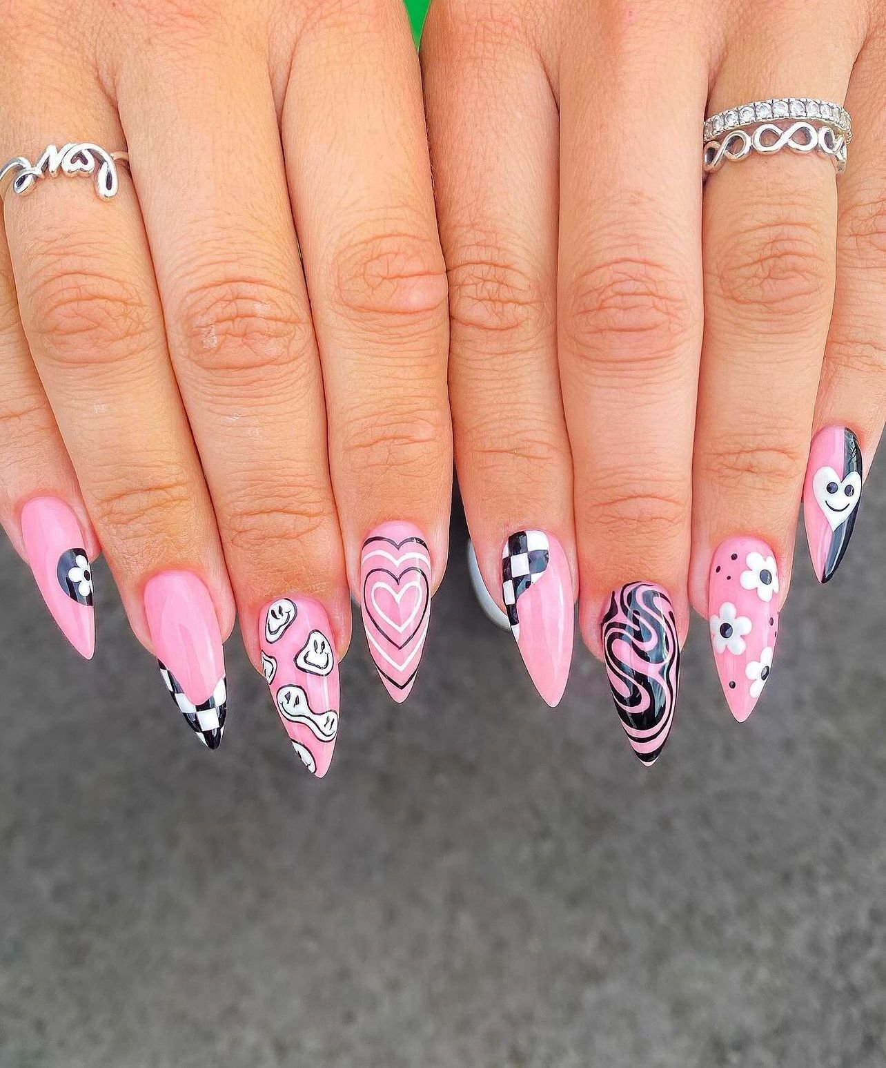 Pink and black checkered Halloween nails
