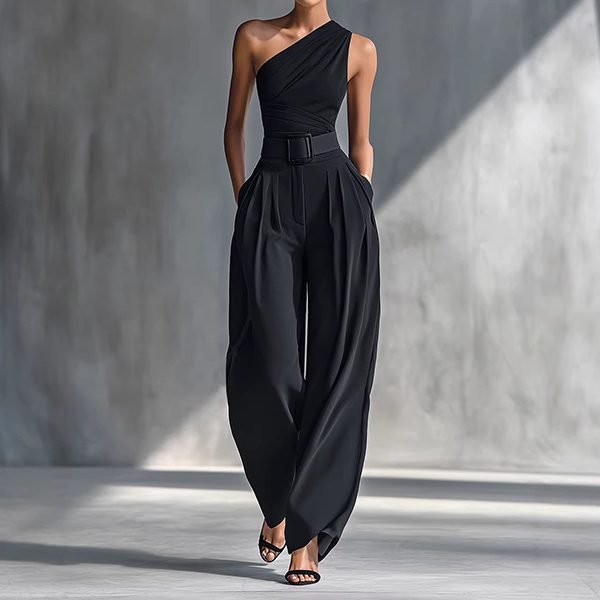 Woman wearing one-shoulder black top with wide-leg pants
