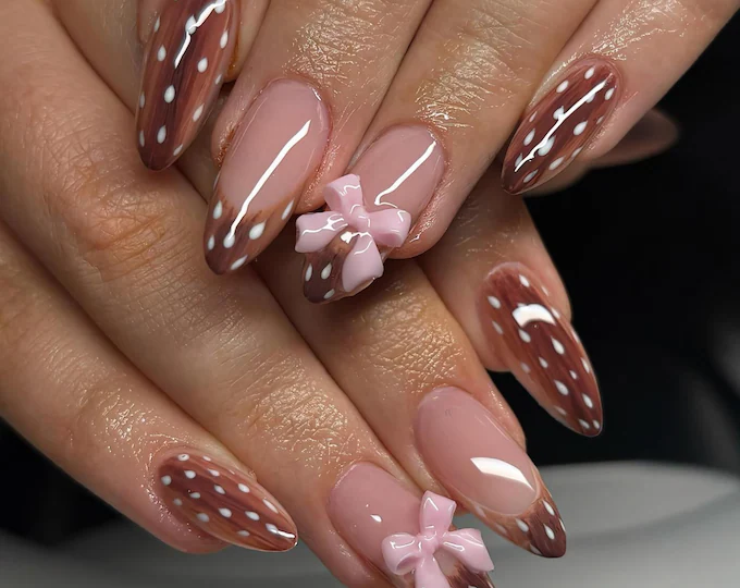 Coquette bow nail art in fall colors for teens