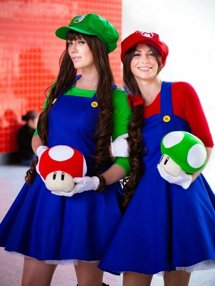 Two women in Mario and Luigi Halloween costumes