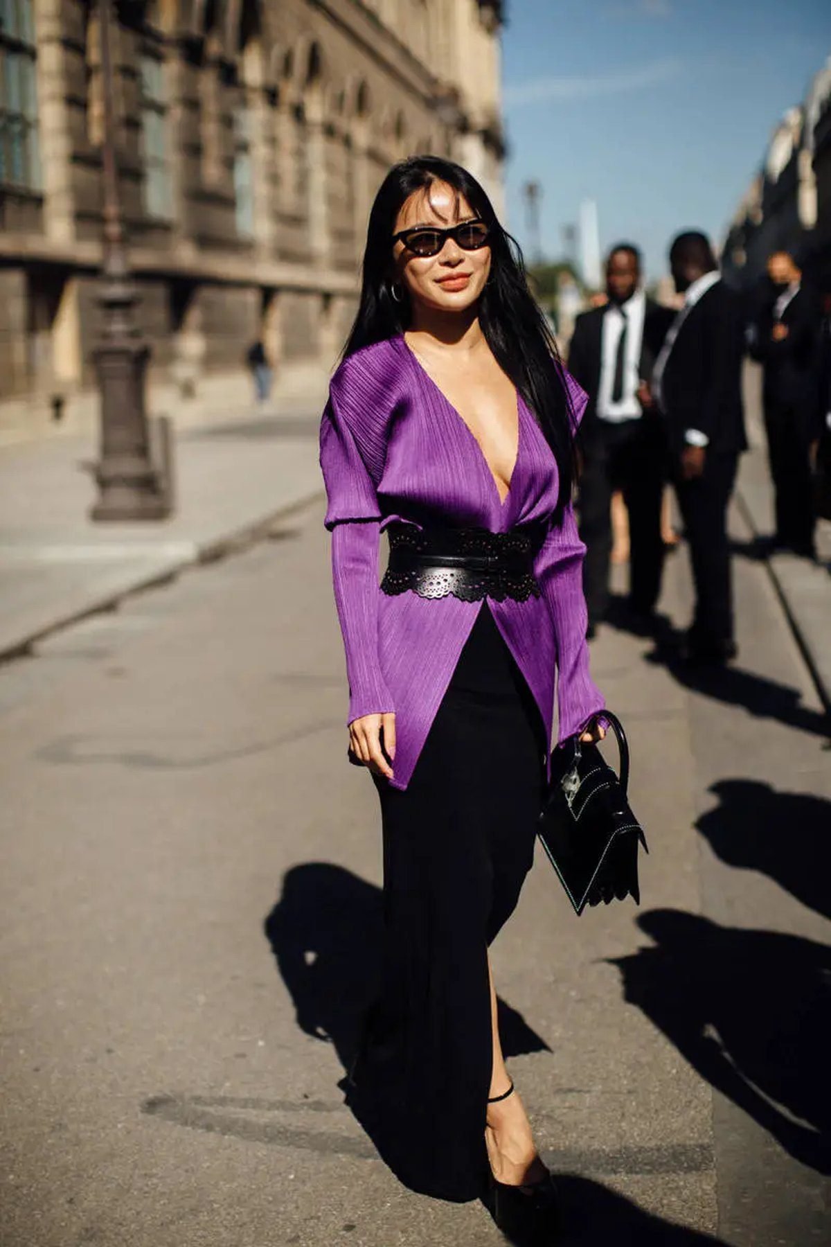 Woman in a purple and black outfit for game day