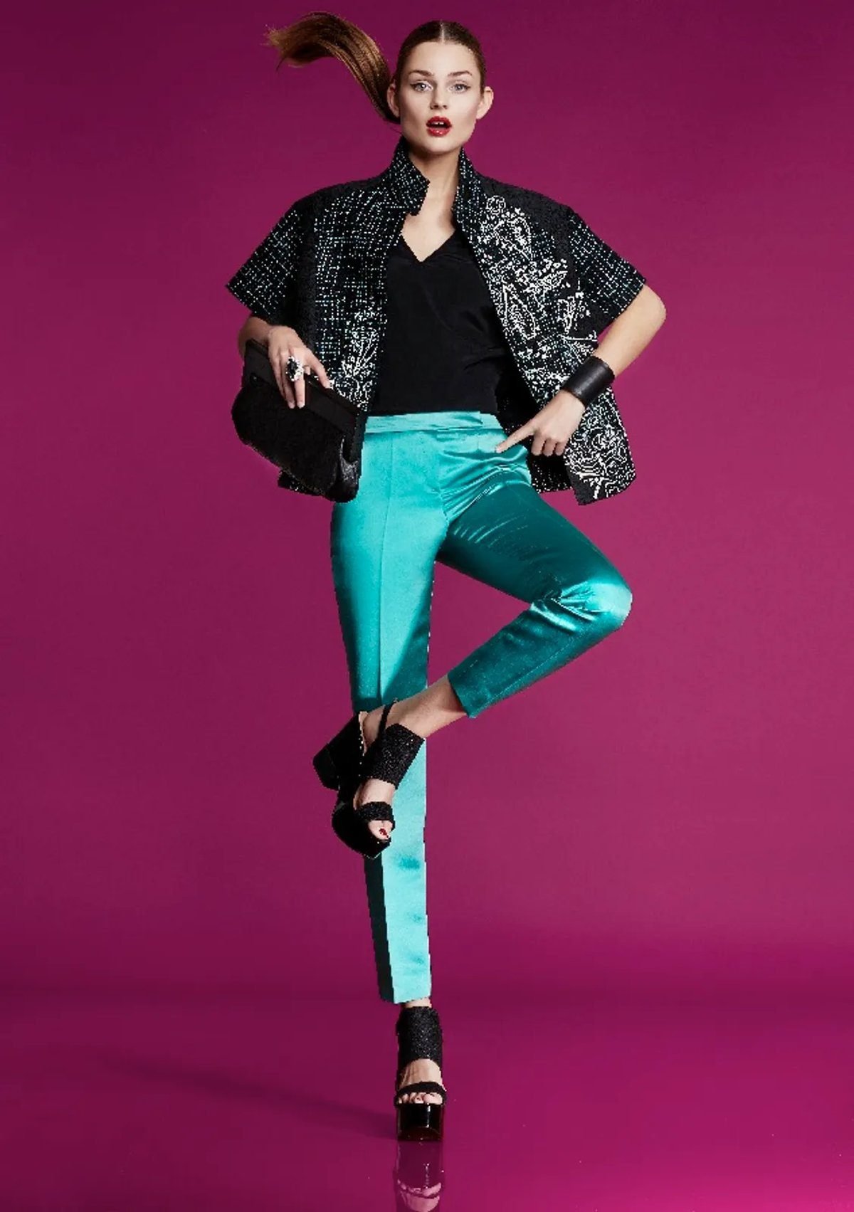Woman in a teal and black outfit for game day