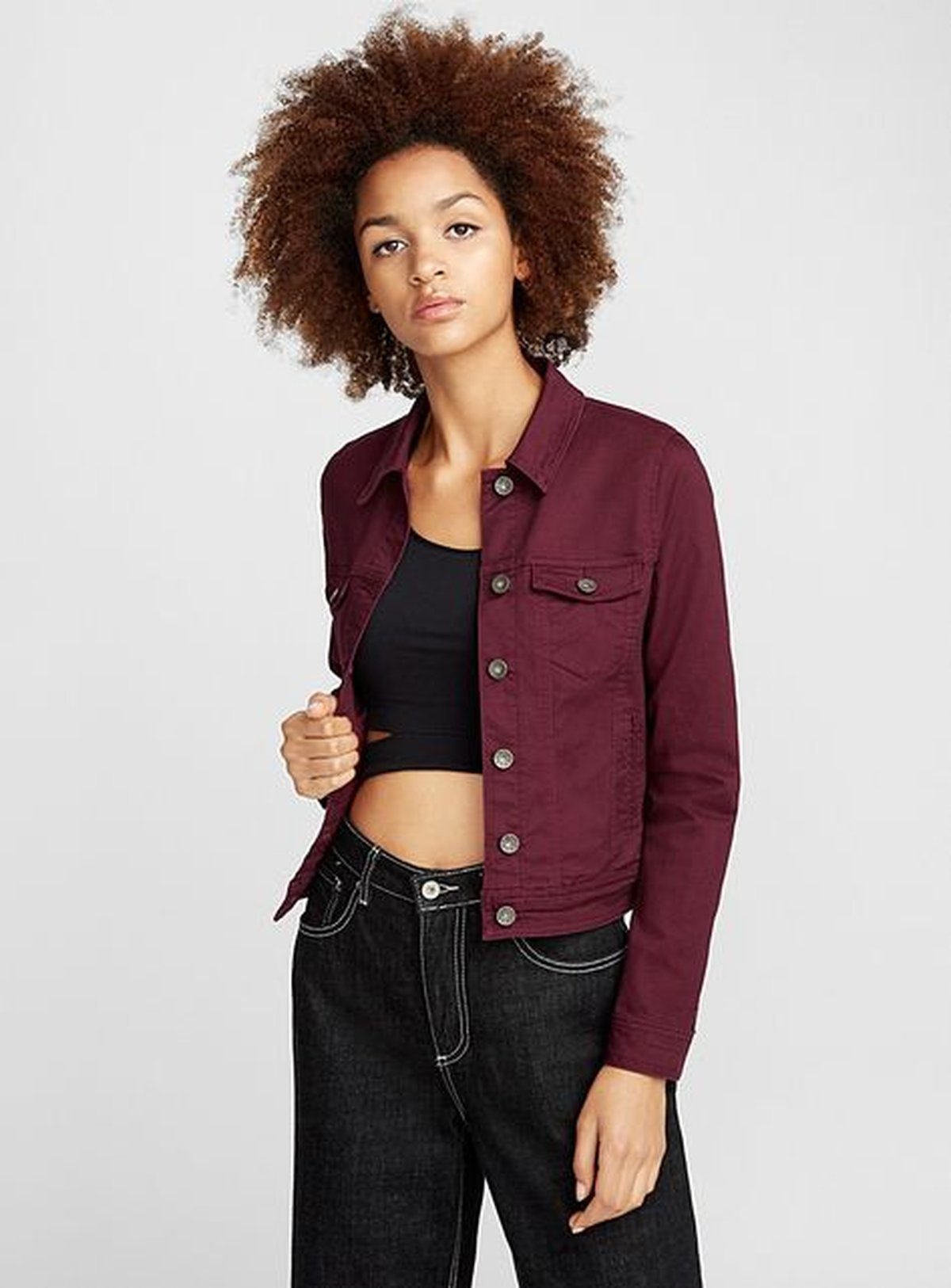 Woman wearing maroon with denim for game day