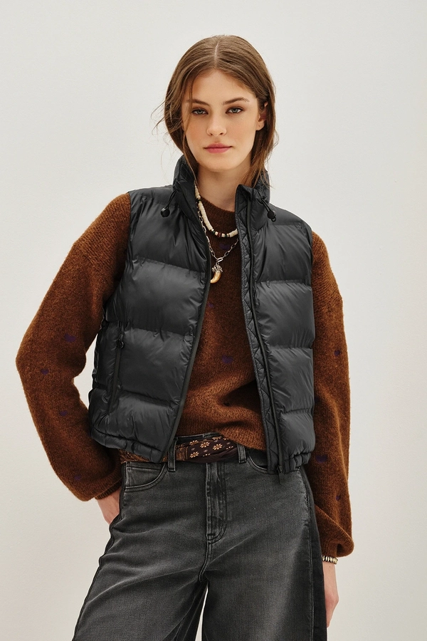 Thin puffer vest over sweater fall outfit