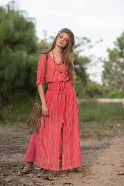 Woman wearing a formal gown with elegant flat sandals