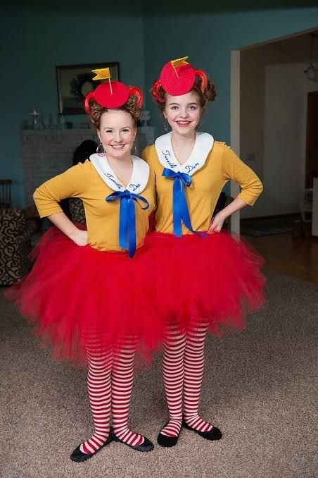 Two women in Tweedledee and Tweedledum costumes