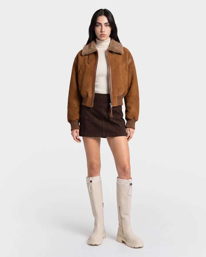 Bomber jacket over turtleneck with mini skirt fall outfit