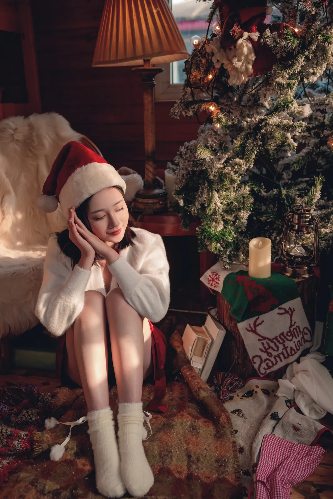 Woman wearing santa hat with cozy outfit