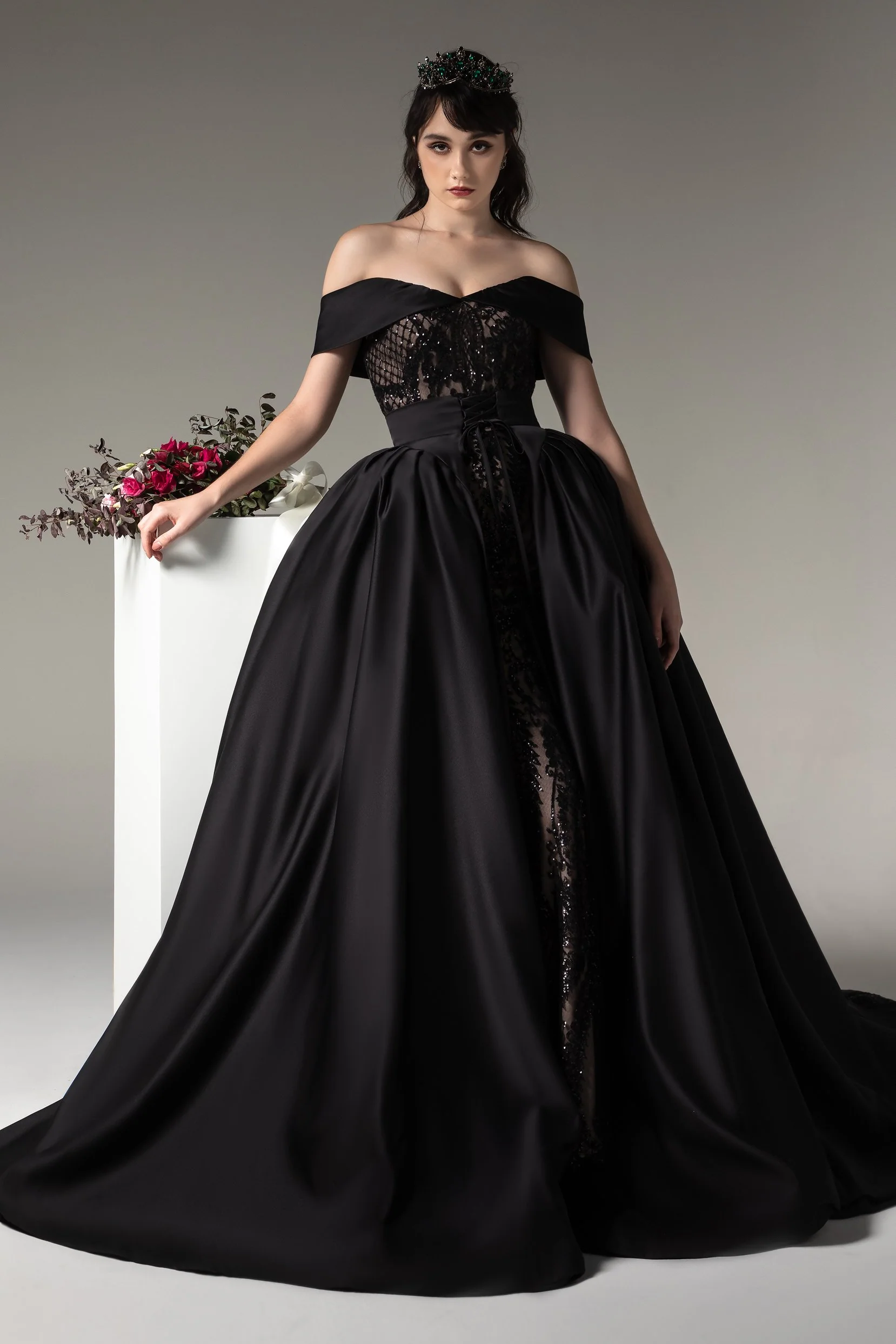 Woman wearing an off-shoulder black ball gown