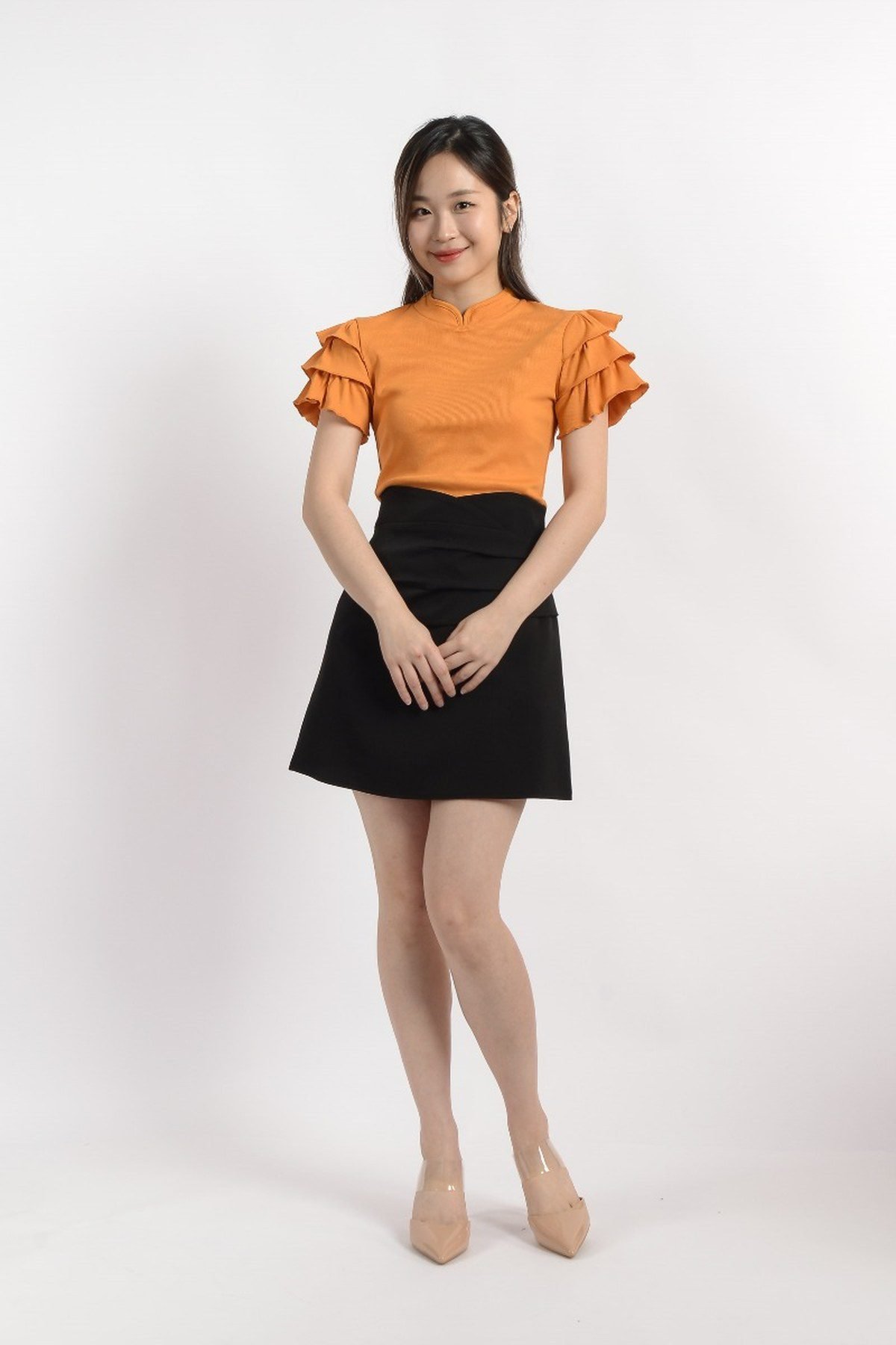 Orange blouse with black trousers outfit for October