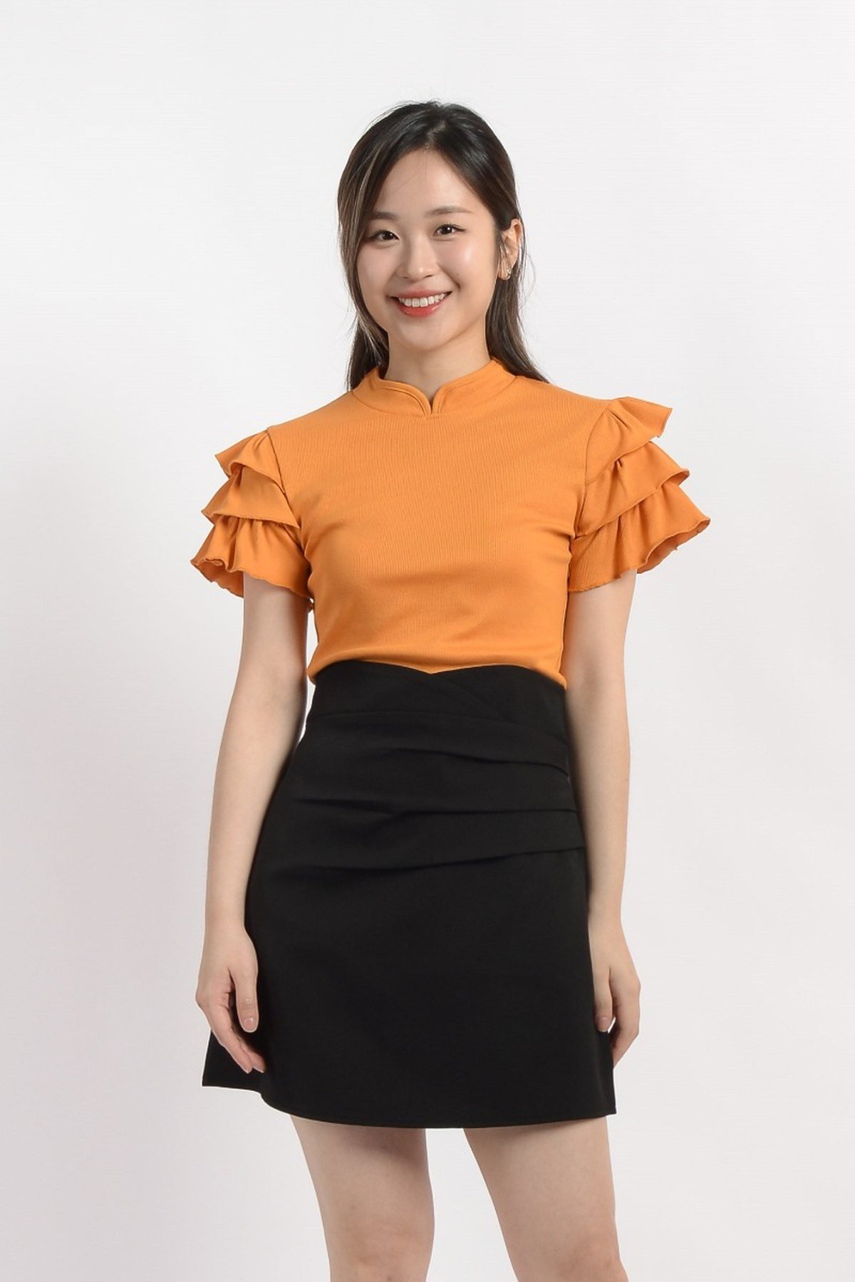 Orange blazer over black outfit October style