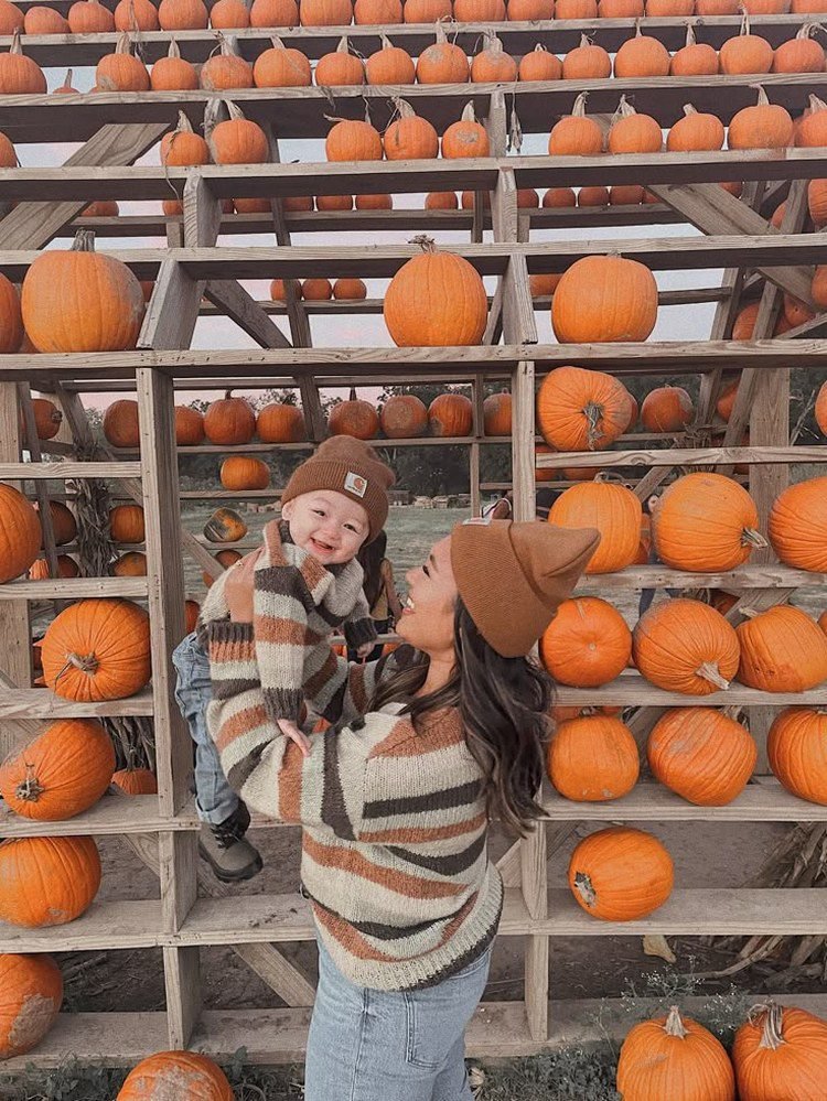 Mom and toddler in denim jackets and floral dresses