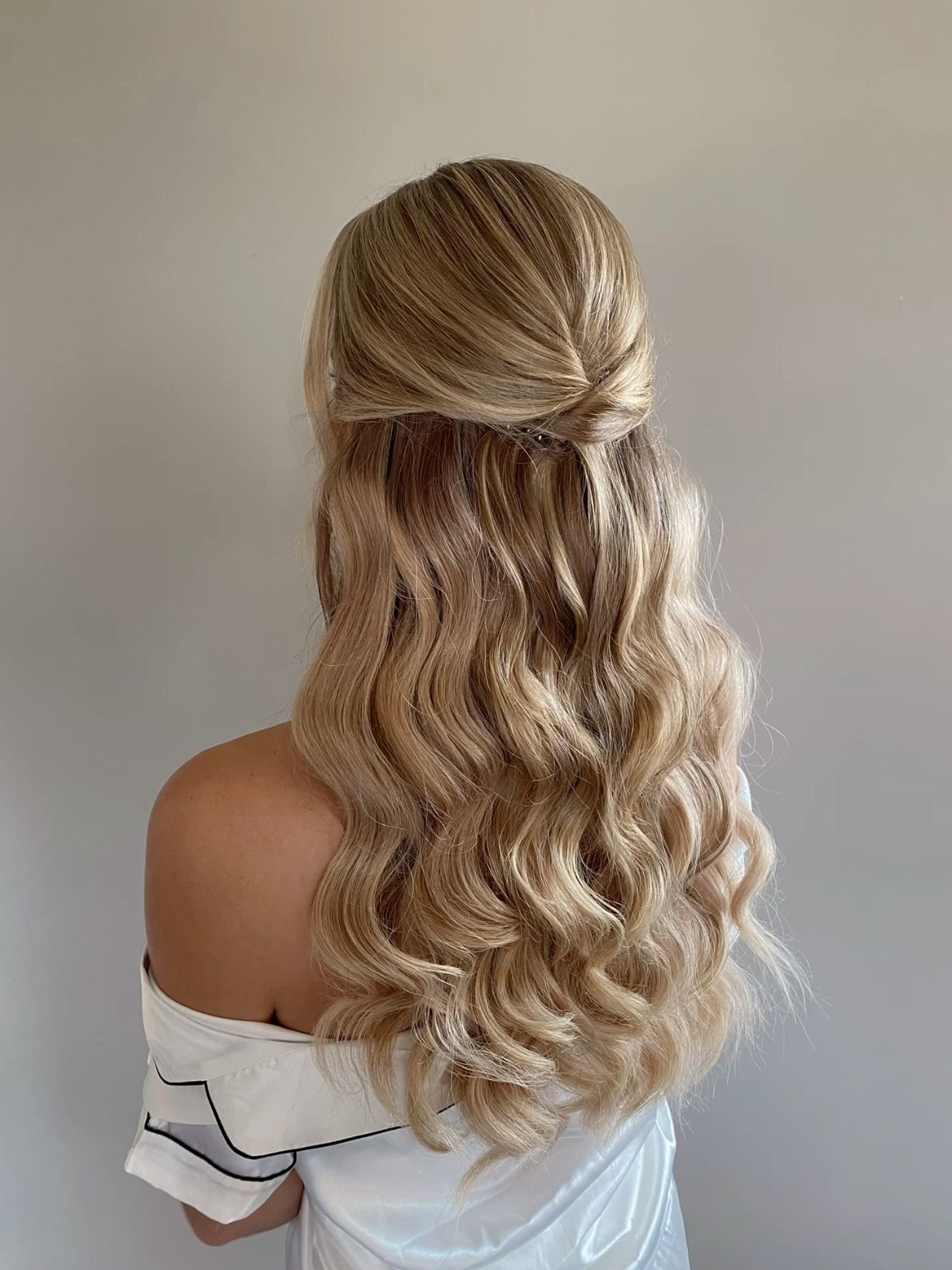 Twisted half up half down hairstyle for homecoming