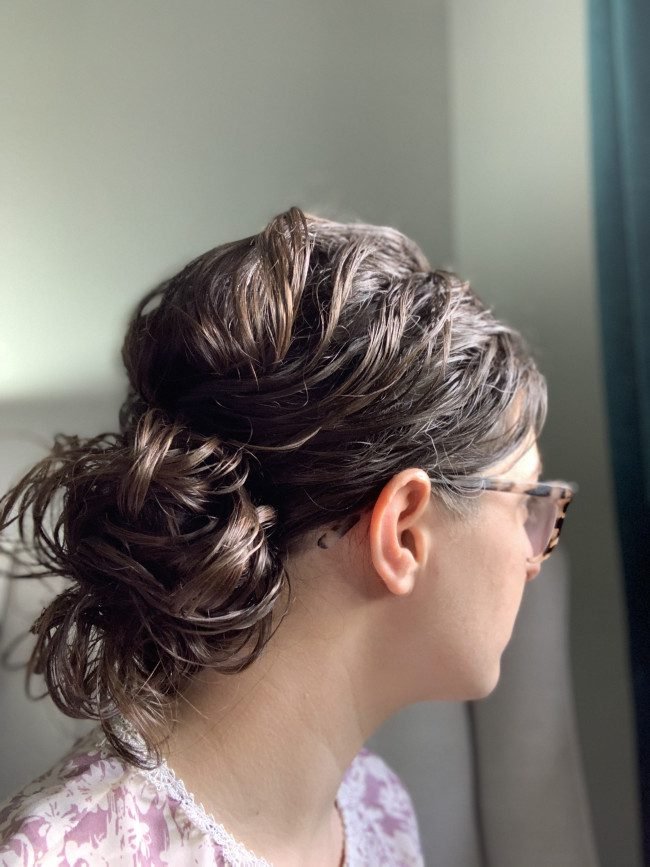 Low chignon rainy day hairstyle